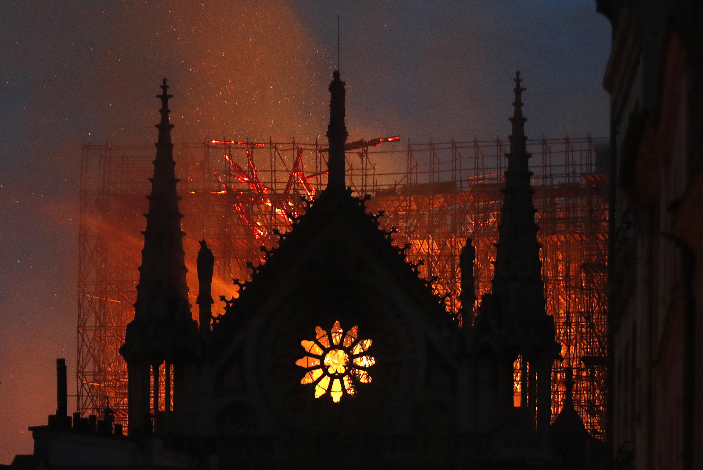 Photo of Notre Dame side wall on fire